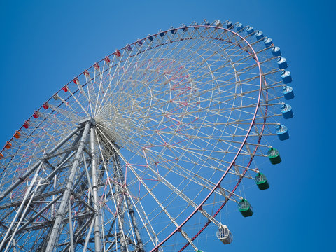 Giant Ferris wheel against the blue sky