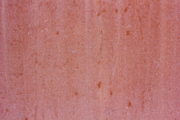 Fototapeta premium Pink plaster concrete wall texture as a background.