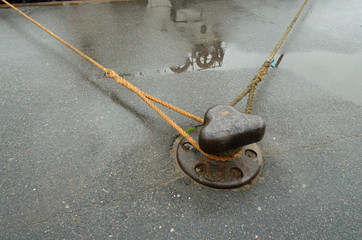 Metal bollard on the dock.