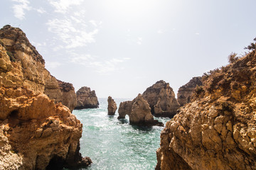 Fototapeta na wymiar Beautiful sandstone rock formation with a cave on Atlantic beach