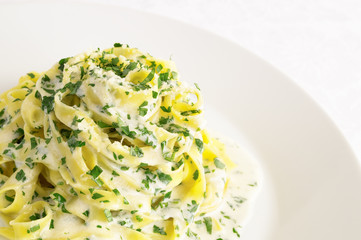 pasta with parmesan butter sauce with addition of cream and parsley