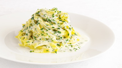fettuccine with parmesan butter sauce with addition of cream and parsley
