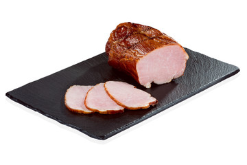 Piece of pork ham on a black stone tray  isolated on white background. Meatworks product