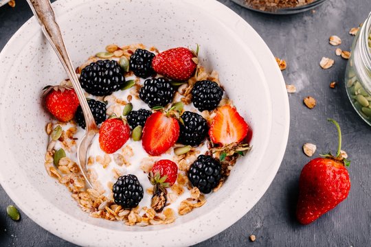 healthy breakfast bowl with homemade granola fresh blackberries and strawberries