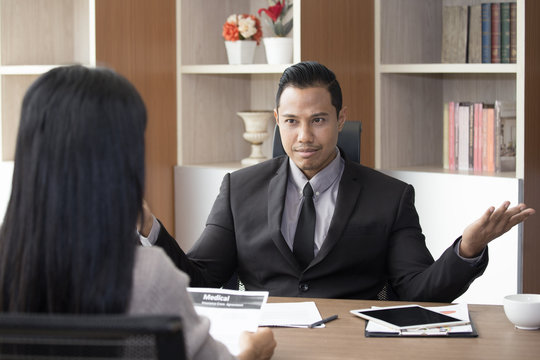 Asian man interview woman for job register with wonder feeling, man with disagree concept