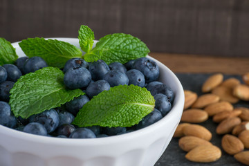 Closeup blueberries, almonds, and mint - a wonderful snack for a healthy lifestyle