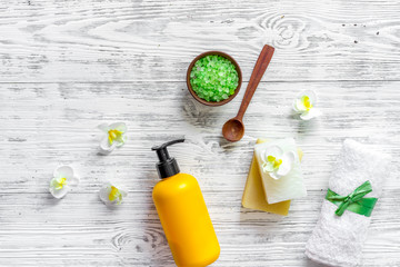 Relax concept. Handmade organic soap and bath salt on wooden table background top view copyspace
