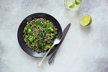 Quinoa salad with broccoli and greenery. Overhead view. Copy space