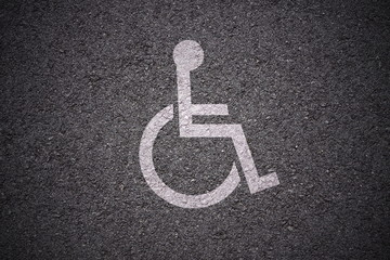 handicapped parking spot on asphalt background texture