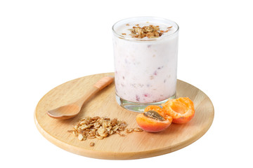 Smoothies with berries apricots and muesli on a wooden stand
