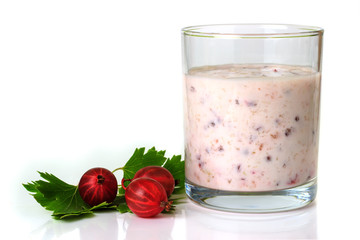 Smoothies with a red gooseberry berry on a white background