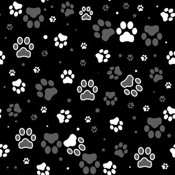 Dog paw print and star seamless pattern on black background