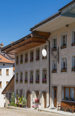 Obraz premium Beautiful old building with the multicolor flowers 1