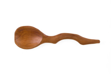 Old rustic, ornate, curved, wooden spoon