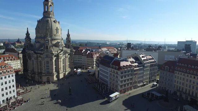 Aerial with blue sky over the baroque church "Frauenkirche", drone view over the historical city Dresden, Germany