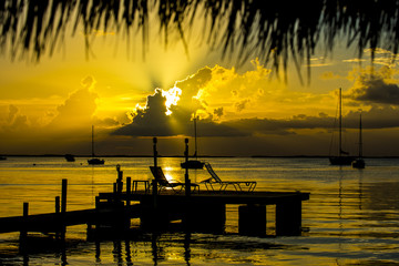 Fototapeta na wymiar sunset dock in foreground ocean 