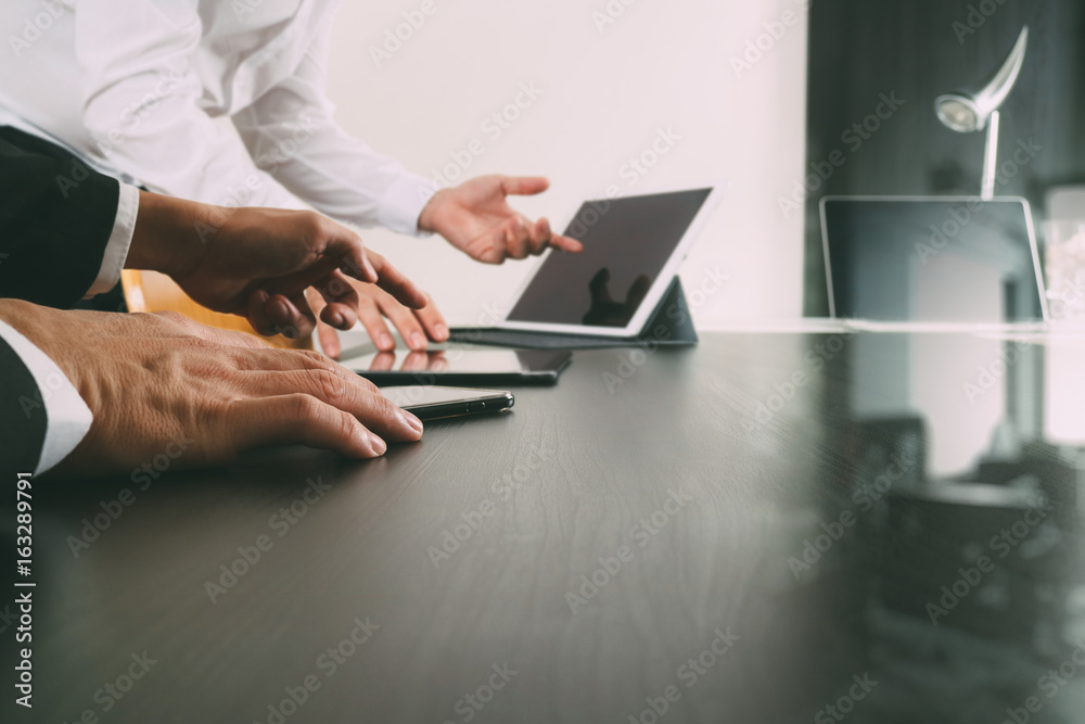 Poster co working team meeting concept,businessman using smart phone and digital tablet and laptop computer in modern office with glass reflected view