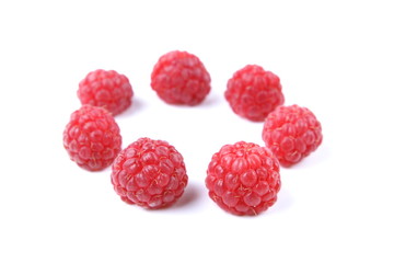 Raspberry on a glossy surface