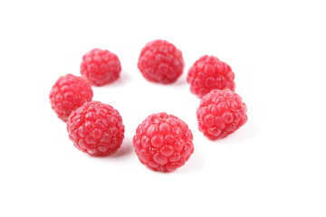 Raspberry on a glossy surface