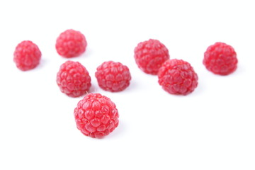 Raspberry on a glossy surface