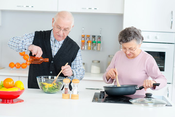Elderly couple cooking