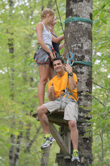 People on adventure course in the woods