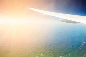 Aircraft wing on the blue sky background