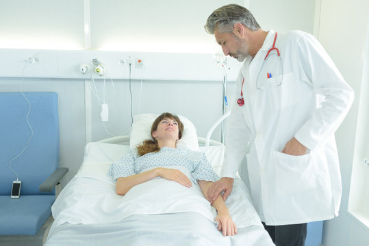 Doctor touching patient's arm