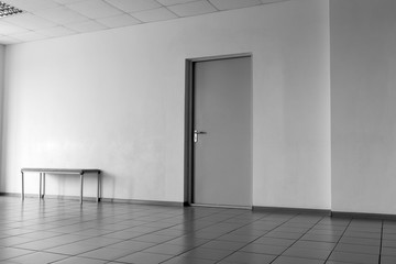 Door in an office room tiled floor