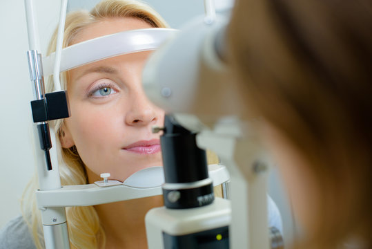 Closeup of lady having eye test