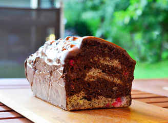Delicious vegan chocolate Marble Cake made with Currants and chocolate icing (made with banana, coconut milk, coconut oil,  coconut oil, maple sirup