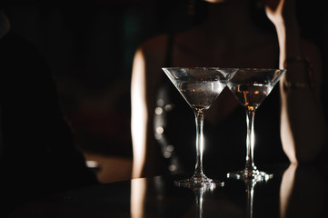 Two glasses of martini coctail in a bar