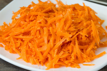 plate with fresh grated carrot