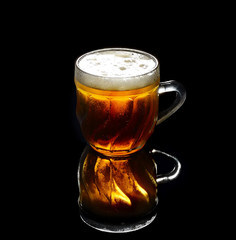Vintage large glass of beer  on black background