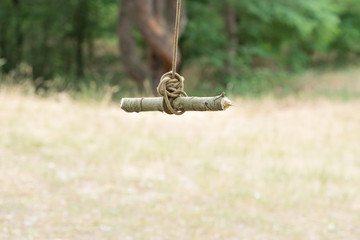 A homemade swing in the forest.Extreme rest.