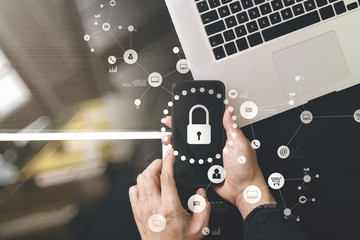 cyber security internet and networking concept.Businessman hand working with VR screen padlock icon...