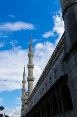 Minaret of sultanahmet mosque and blue cloudy skies