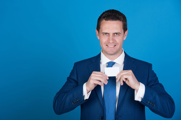 manager smiling with bank or business card