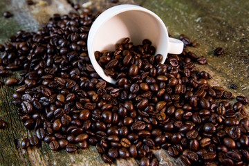 Coffee. Coffee beans. Coffee cup full of coffee beans. Coffee beans in a white mug