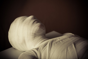 Close up view of young mummy wrapped in gauze