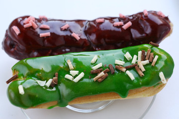 mint and chocolate eclair close up photo on plate