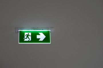 green emergency exit sign