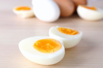 Sliced hard boiled eggs on light background. Nutrition concept