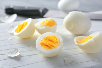 Cutting board with hard boiled eggs, closeup. Nutrition concept