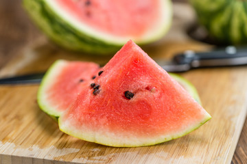 Portion of Fresh Watermelon on wooden background (selective focus).