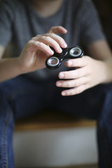 Little Boy Playing with a Fidget Spinner