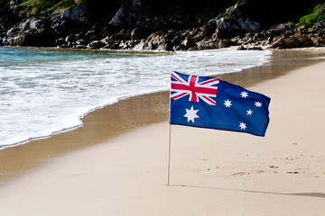 Australian Flag waving in the wind on the beach