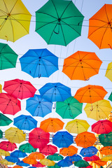 multicolored umbrellas in the sky