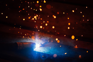 artistic welding sparks light, industrial background