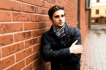 Confident  man young businessman looking to the side portrait against city